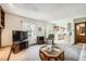 Open living room showcasing a seamless transition to the kitchen and outdoor access at 3240 E 128Th Pl, Thornton, CO 80241