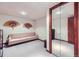 Finished living room featuring seating, closet and mirrored wall at 3240 E 128Th Pl, Thornton, CO 80241