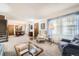Spacious living room with neutral carpet, natural light, staircase, and dining area at 3240 E 128Th Pl, Thornton, CO 80241