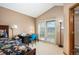 Bedroom with vaulted ceiling, neutral paint, and a door leading to a private balcony at 7900 E Dartmouth Ave # 75, Denver, CO 80231