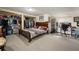 Bedroom featuring a walk-in closet, a window, a desk, and a modern wood frame bed at 7900 E Dartmouth Ave # 75, Denver, CO 80231