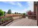 Spacious wooden deck featuring a brown railing and space for outdoor entertaining at 7900 E Dartmouth Ave # 75, Denver, CO 80231