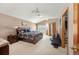 Main bedroom with a vaulted ceiling, a large bed, neutral walls, and a walk-in closet at 7900 E Dartmouth Ave # 75, Denver, CO 80231