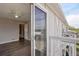Balcony view from an upstairs bedroom, showing sliding door and ceiling fan at 4670 W Nevada Pl # A, Denver, CO 80219