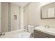 Stylish bathroom includes unique tile accents, modern vanity and ample storage at 4670 W Nevada Pl # A, Denver, CO 80219