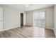 Spacious bedroom with hardwood floors, closet, and sliding glass doors to balcony at 4670 W Nevada Pl # A, Denver, CO 80219