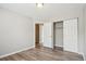 Neutral bedroom features closet space and access to other areas of the house at 4670 W Nevada Pl # A, Denver, CO 80219