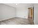 Bright bedroom featuring hardwood floors and neutral paint at 4670 W Nevada Pl # A, Denver, CO 80219