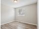 Bedroom with hardwood floors and a window with a blind at 4670 W Nevada Pl # A, Denver, CO 80219