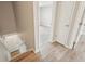 Hallway with views to a bedroom and stairs to the basement at 4670 W Nevada Pl # A, Denver, CO 80219