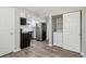 Stylish kitchen with modern black appliances and a stainless steel refrigerator at 4670 W Nevada Pl # A, Denver, CO 80219