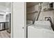 Convenient laundry area with modern appliances, located near the kitchen at 4670 W Nevada Pl # A, Denver, CO 80219