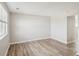 Bright and airy living room features new wood floors and neutral paint at 4670 W Nevada Pl # A, Denver, CO 80219