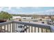 A balcony view reveals a residential area with tree coverage and a sunny sky at 4670 W Nevada Pl # A, Denver, CO 80219