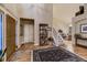 Grand foyer with hardwood floors, a staircase, and a view into the living room at 20510 Oakbrook Ln, Parker, CO 80138