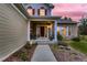 Inviting front porch with stylish columns and a cozy seating area at 20510 Oakbrook Ln, Parker, CO 80138