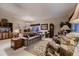 Comfortable living room featuring a variety of seating options and elegant decor at 20510 Oakbrook Ln, Parker, CO 80138