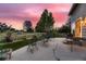 An inviting outdoor patio area perfect for entertaining with lovely sunset views at 20510 Oakbrook Ln, Parker, CO 80138