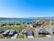 Community with lake views, landscaped yards, and well maintained homes at 32 Latigo Pl, Littleton, CO 80123