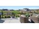 Cozy backyard patio with comfortable seating overlooking a lush green space and neighborhood homes at 32 Latigo Pl, Littleton, CO 80123