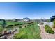 Landscaped backyard with beautiful green grass, stone features and lovely plants at 32 Latigo Pl, Littleton, CO 80123