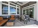 A covered patio with comfortable seating and views of the surrounding landscape at 32 Latigo Pl, Littleton, CO 80123