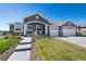Charming single-Gathering home with landscaped yard and a three car garage at 32 Latigo Pl, Littleton, CO 80123