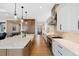 Contemporary kitchen featuring stainless steel appliances, a large island, and ample counter space at 32 Latigo Pl, Littleton, CO 80123