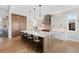 Modern kitchen with a large island, stainless steel appliances, and ample cabinet space at 32 Latigo Pl, Littleton, CO 80123