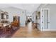 Spacious living area with hardwood floors connects the dining room, kitchen, and Gathering room at 32 Latigo Pl, Littleton, CO 80123