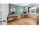 Stylish home office with natural light, modern desks, and a comfortable workspace at 32 Latigo Pl, Littleton, CO 80123