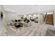 A spacious recreation room features comfortable seating, a home gym, and stairs at 32 Latigo Pl, Littleton, CO 80123