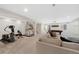 A spacious recreation room is equipped with a home gym, pool table, and comfortable seating at 32 Latigo Pl, Littleton, CO 80123