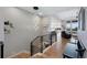 Modern staircase features sleek railings and an open design, leading to the upper level at 32 Latigo Pl, Littleton, CO 80123