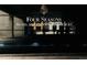 Nighttime view of Four Seasons Residences signage on dark facade at 1133 14Th St # 2110, Denver, CO 80202