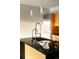Modern kitchen island with granite countertops, stainless steel appliances, and designer lighting at 1133 14Th St # 2110, Denver, CO 80202