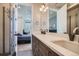 Modern bathroom featuring a double sink vanity and glass shower, seamlessly connected to the bedroom at 1583 Grove St # 5, Denver, CO 80204