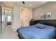 Bedroom with a comfortable bed, neutral walls, and a view to the upstairs hall at 1583 Grove St # 5, Denver, CO 80204