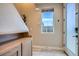 Foyer with coat rack, tile flooring, and access to the upper floors at 1583 Grove St # 5, Denver, CO 80204