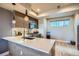 Bright kitchen with quartz countertops, stainless steel appliances, and pendant lighting at 1583 Grove St # 5, Denver, CO 80204