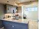 Modern kitchen island with quartz countertop, undermount sink, and stainless steel appliances at 1583 Grove St # 5, Denver, CO 80204