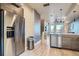Modern kitchen features stainless steel appliances, wood cabinets, and hardwood floors at 1583 Grove St # 5, Denver, CO 80204