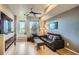 Bright living room with a fireplace and large windows and comfortable seating at 1583 Grove St # 5, Denver, CO 80204