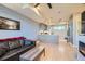 Open-concept living space with modern kitchen and comfortable seating area at 1583 Grove St # 5, Denver, CO 80204