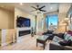 Cozy living room featuring a fireplace, large window, and comfortable seating at 1583 Grove St # 5, Denver, CO 80204