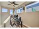 Upper-level office space with city views, featuring a modern desk and chair setup, illuminated by natural light at 1583 Grove St # 5, Denver, CO 80204