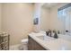 Stylish powder room with sleek vanity, modern fixtures, and a decorative mirror at 1583 Grove St # 5, Denver, CO 80204