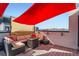 Inviting rooftop deck with comfortable seating around a fire pit, perfect for enjoying city views at 1583 Grove St # 5, Denver, CO 80204