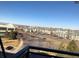 Scenic view of complex showcasing apartments and parking lot, with mountain views beyond at 10176 Park Meadows Dr # 2403, Lone Tree, CO 80124