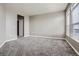Bedroom with neutral walls, gray carpet, closet, and a window with blinds at 10176 Park Meadows Dr # 2403, Lone Tree, CO 80124